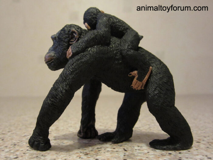 Chimpanzee with baby on its back figurine.